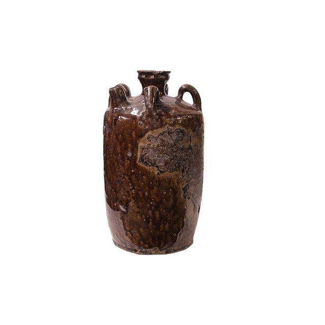 Elevate your decor with the understated elegance of an Oriental brown glaze jar. This captivating ceramic piece showcases...