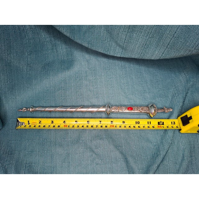 Curator's Note: This 1844 Torah pointer is more than a liturgical instrument; it is a profound historical artifact. Its...