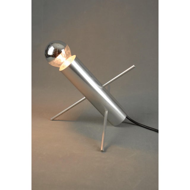 The cricket table lamp (model r-60), designed in 1962 by otto wasch for raak amsterdam, is a distinctive example of early...