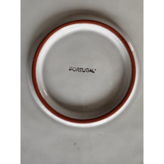 Presenting a set of vibrant color floral motif terra cotta ceramic plates made in Portugal. With lovely earthy brown...