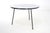Round coffee table, Dutch Design. Sleek round coffee table with white formica top on steel base with 3 legs. Minimalist...