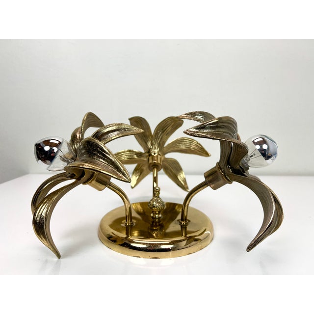 Beautiful ceiling lamp attr. to Willy Daro, consisting of 3 gold tone brass flowers on a circular brass plated base with a...