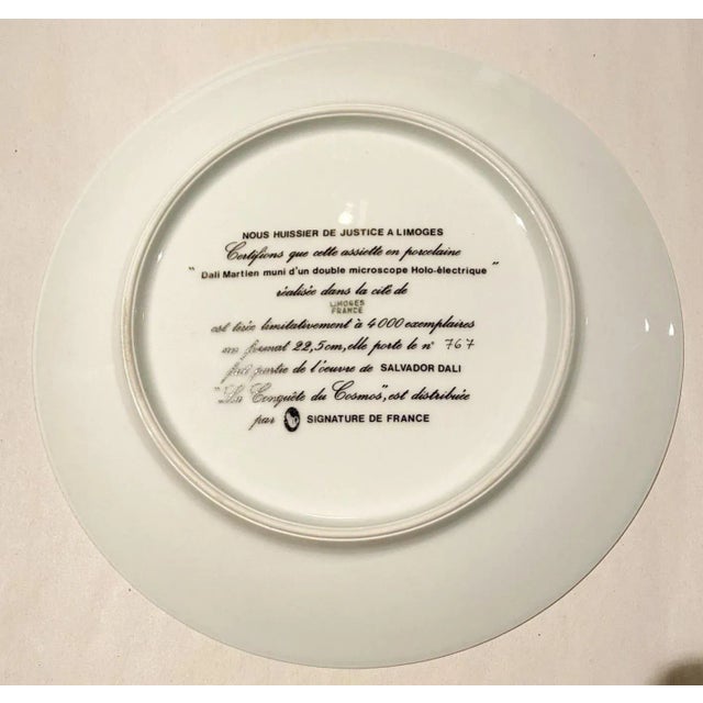 Salvador Dalí (after) Dali Martien muni d'un double microscope Holo-électrique Color silkscreen on Limoges porcelain plate...