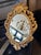A very well carved giltwood Rococo style oval mirror by Harrison & Gil The bevelled oval mirror plate surrounded by a...