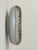 Murano pressed glass wall sconce with a central mirror-polished stainless steel disc, produced in Italy in the 1960s. An...