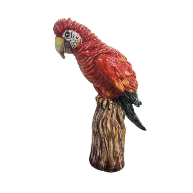 Bring vibrant tropical character and artistic craftsmanship into your decor with this striking vintage ceramic macaw...