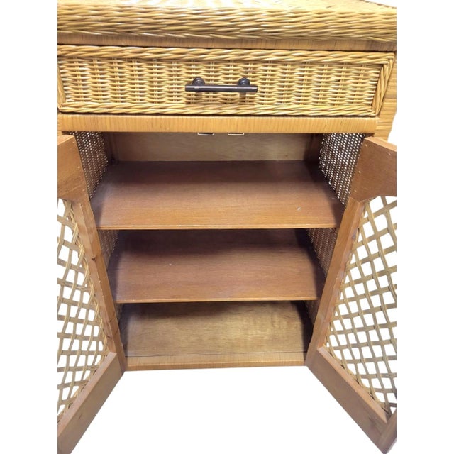 A perfect small.wicker cabinet for a bathroom or kitchen. This sweet little wicker cabinet can hold toiletries, towels and...
