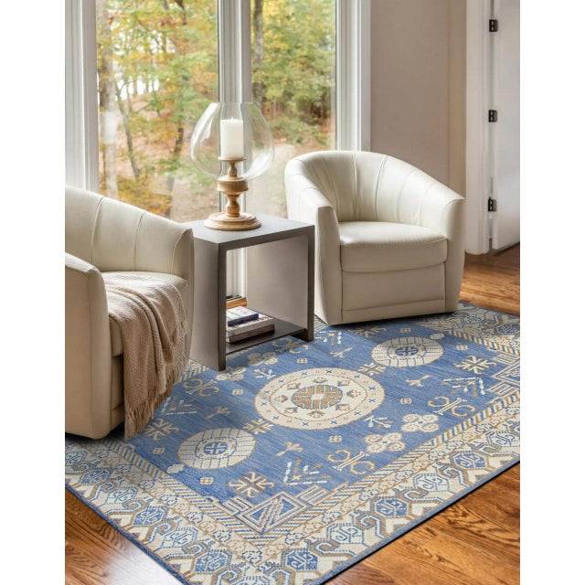Traditional Blue Hand Knotted Wool Rug, Country of Origin: India. This exceptional piece showcases the mastery of weaving...