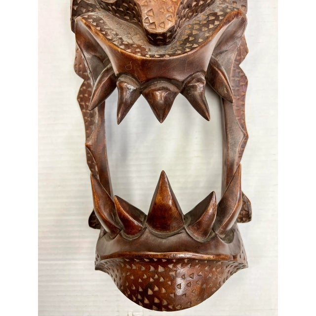 Large Asian hand carved wood mask of a demon.
