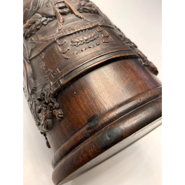 Chinese Rosewood brush holder (pen pot) circa late Qing dynasty. Finely carved on surface with a sitting Buddha on lotus...