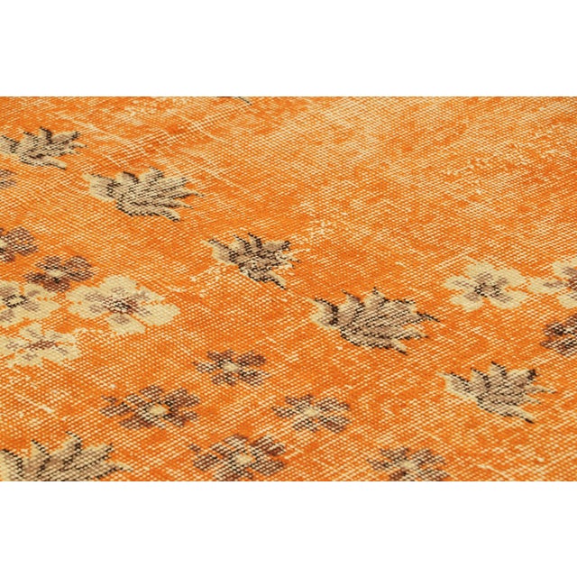 Hand-knotted in wool and originating from Turkey circa 1960 – 1970, this 6x9 vintage Zeki Müren rug is a unique addition...