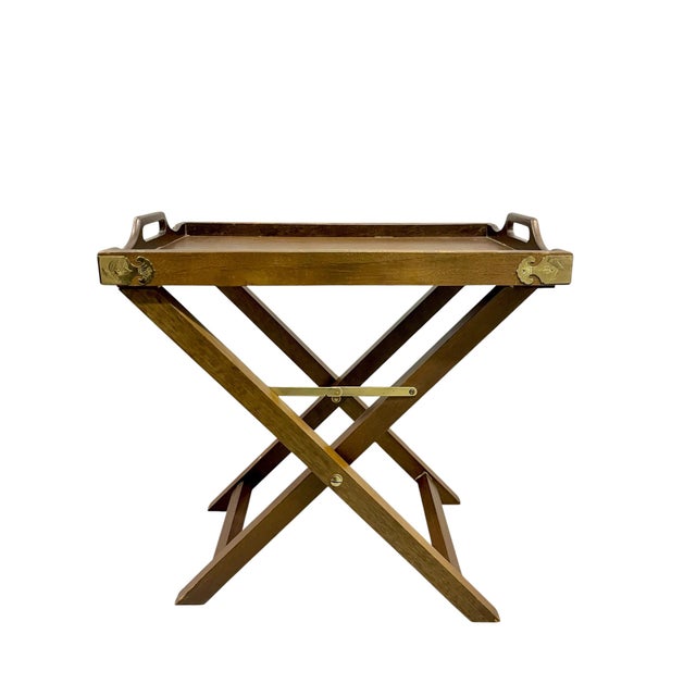 A timeless pair of vintage English-style folding tray tables that effortlessly blend classic campaign design with refined...