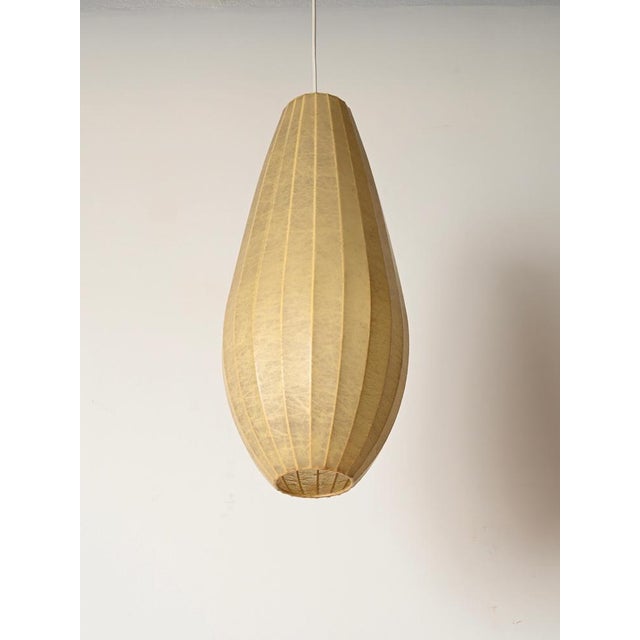 Spectacular large teardrop-shaped beige cocoon pendant. This outstanding and incredibly rare piece was designed by achille...