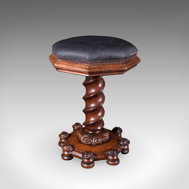 This is an antique estate chapel organist's stool. A Scottish, walnut and leather music riser stool in Gothic Revival...