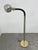 Sleek vintage adjustable floor lamp featuring a chrome finish with brass-tone accents and a flexible gooseneck for easy...