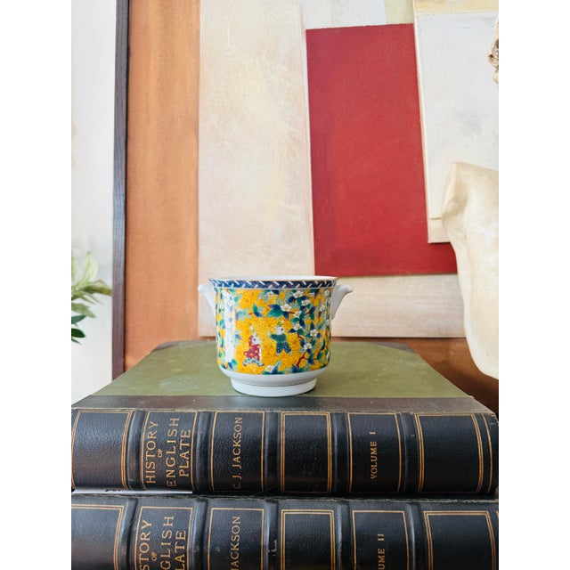 A vibrant vintage hand-decorated cachepot by Windsor Takahashi, featuring a richly detailed multicolor pattern with...