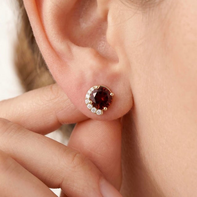 Add timeless elegance to your jewelry collection with these stunning Garnet Stud Earrings. These earrings feature rich,...