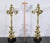 Pair of gilded bronze candelabra with four lights. Overlooked from a central candle holder with cork, on each candlestick,...