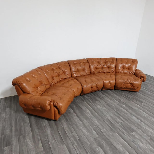 An extraordinary and comfortable vintage modular corner sofa dating back to the 1970s and inspired by the celebrated...