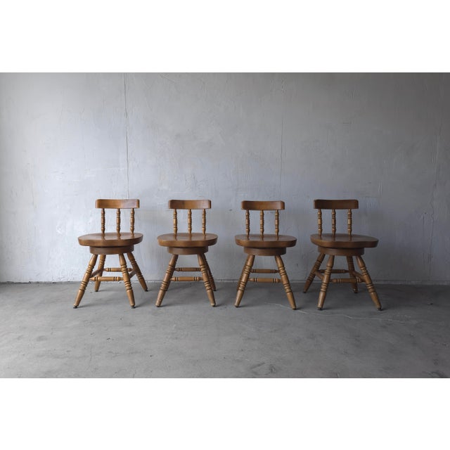 Love this Vintage set of 4 pub style American Colonial Windsor Swivel Chairs. These charming chairs feature sculpted...