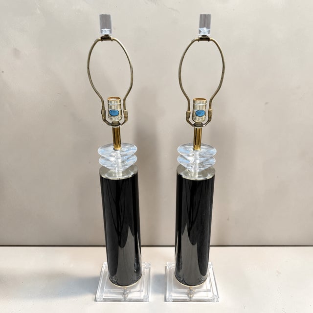 This is a stunning pair of 1980s postmodern deco style table lamps, consisting of stacked geometric lucite shapes, high...