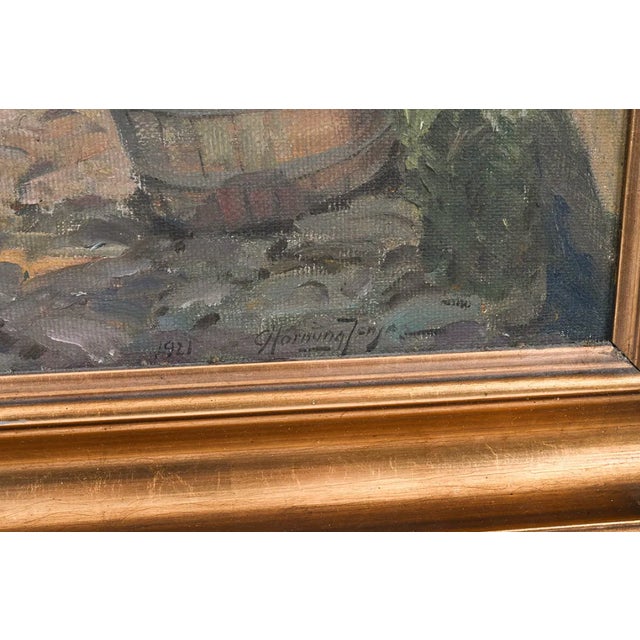 This signed oil on canvas depicts a charming cottage garden in a warm, naturalistic Impressionist style. Rich terracotta...
