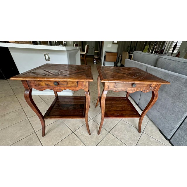 Pair large scale "Castle Bromwich by Hand" French Provincial style side or end tables by Theodore Alexander. Crafted from...