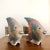 A pair of Colorful Hand Carved Wood Fish Figurines. Circa 1980s. Features incised fish scales and fin details in pastel...