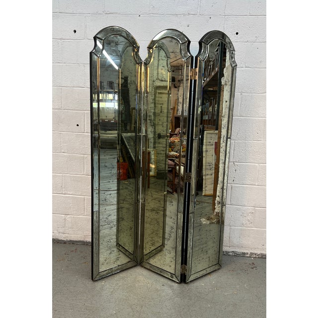 Bring timeless glamour and sophisticated style to your space with this stunning Hollywood Regency three-panel mirrored...