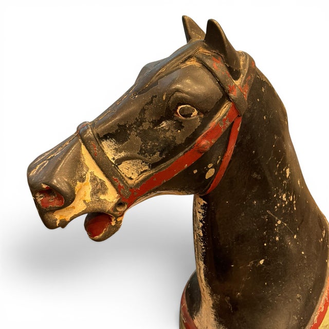 A rare and captivating piece of American amusement history, this antique cast metal carousel horse retains its remarkable...