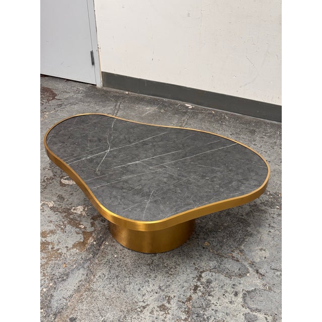 Design Plus Gallery presents a Custom Kidney Coffee Table from Michael Oren Design. The top is Black Marquina marble with...
