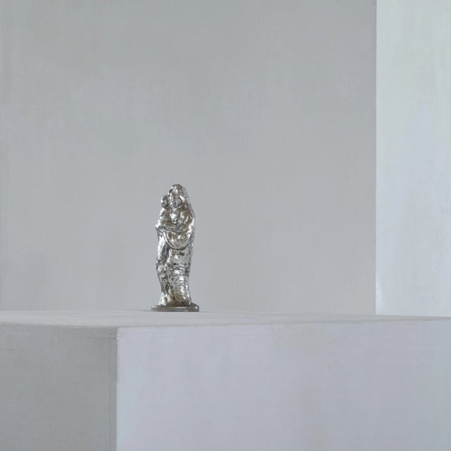 Antique Patinated Mercury glass Madonna with child. Turn of the century / Early 20th century. This is a wonderful and...