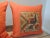 Set of ‘2’ Bright Orange Indian Suzani Square Decorative Pillows Pillows depicting colorful peacocks and woven flowers....