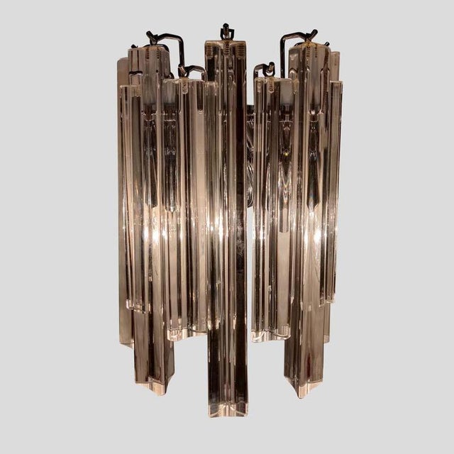 Pair of clear Murano glass Triedri wall lights. Clear glass components on chromed steel structure. Made in Italy This...