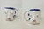 Here is a unique handcrafted decorative mug featuring two faces - a blue-eyed face on one side and a green-eyed face on...