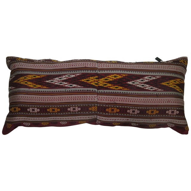 Pillow made from a mid-20th century Turkish textile. Bolster size. 11'' x 24''.