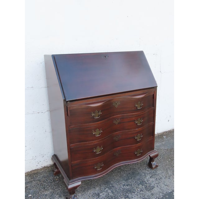 This Secretary Desk is made out of wood, solid wood, mahogany, and veneer. It was made by Pray's Furniture and it is...