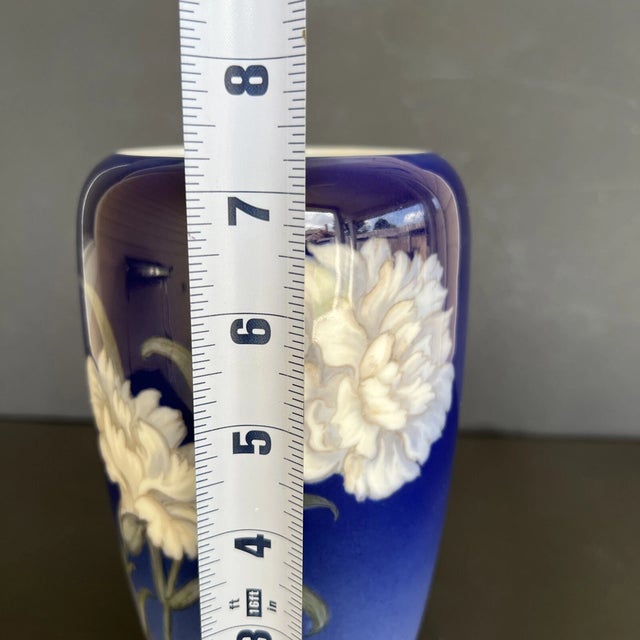 Elegant Royal Copenhagen porcelain vase in the classic Blue Flower pattern, dated 1937. This 7.25-inch vase features...