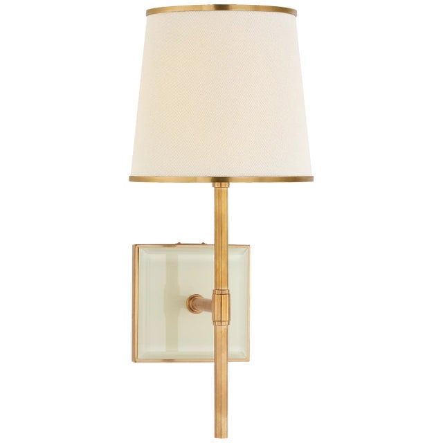 Bradford Medium Sconce in Soft Brass and Cream with Cream Linen Shade with Soft Brass Trim Designer: kate spade new york...