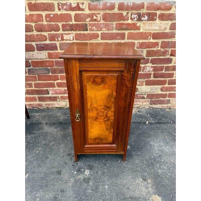 Antique Victorian style walnut burled wood bedside cabinet It feautes a panelled door and a raised gallery around the top...