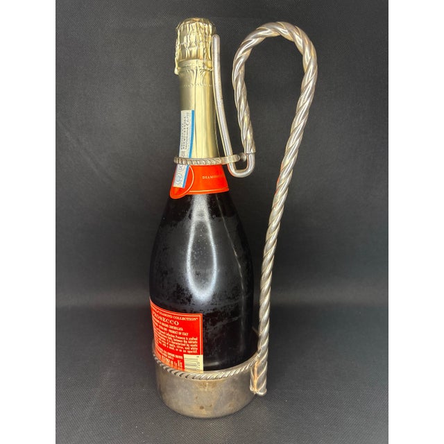 The Sheffield Silver-Plated Round Bottle Caddy with Handle is a touch of vintage style and practical addition to any home...