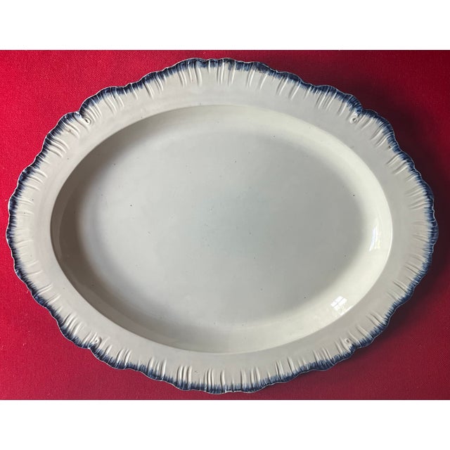 Large antique 18th century English George III creamware blue shell edge or feather edge oval platter circa 1790. Measures...