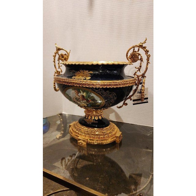This listing features a Limoges style cobalt blue handled centerpiece with gilt bronze and hand painted ornamentation....