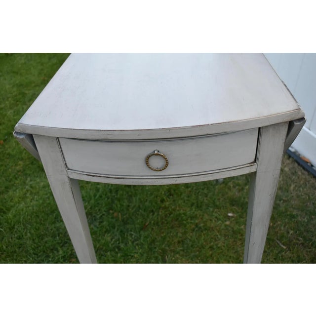 Vintage (1970's) Pembroke Table has a Traditional Style. The Wood is Mahogany. The Table has a Glacier Gray Distressed...