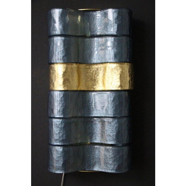 This pair of sconces is magnificent. It features large curved glass ribbans in blue-grey iridescent and gold glass. Each...