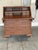 Elegant vintage mahogany secretary desk with beautiful wood grain and timeless craftsmanship. Features a fold-down writing...