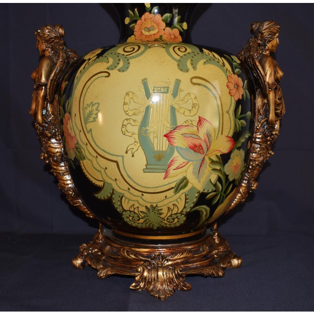 Vintage (1980's) Large Vase/Urn has a Neo-Classic Style. Made of Ceramic/Pottery with a Floral & Figural Motif. The...