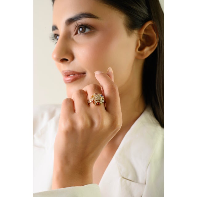 This Retro-style cluster ring features 6 octagon cut multi sapphires totaling 1.73 carats, set in rich 14k yellow gold....
