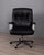 Swivel office chair with cast aluminum frame and black leather upholstery, model "P128", designed by Osvaldo Borsani for...
