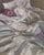 This oil painting captures a serene moment of rest, depicting a figure nestled in soft, rumpled bedding. The gentle...